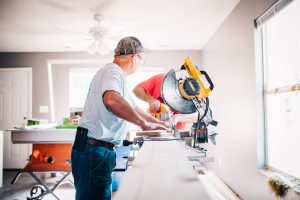 two men working on appliance installation help